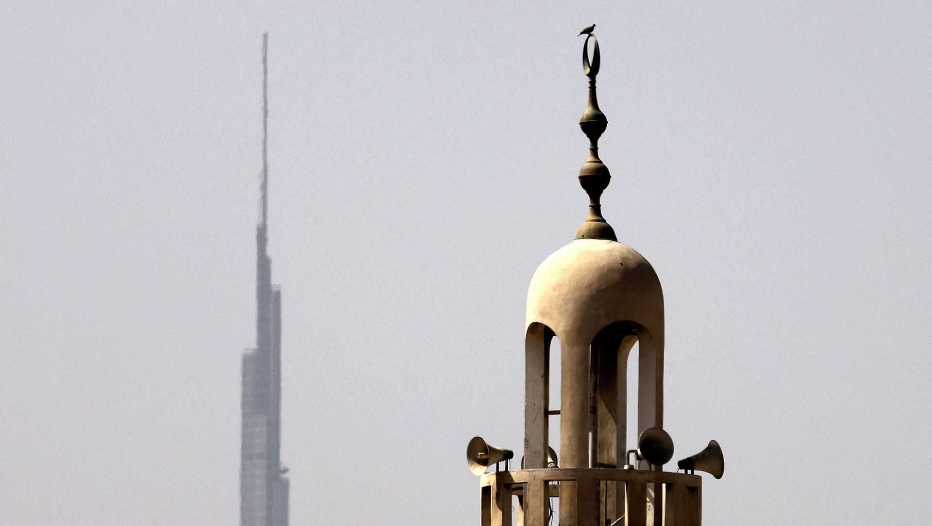 Burj Khalifa, the world's tallest tower, is silhouetted in the background of a mosque's minaret in Dubai in the United Arab Emirates, ahead of the Muslim fasting month, on April 12, 2021. Burj Khalifa, the world's tallest tower, is silhouetted in the background of a mosque's minaret in Dubai in the United Arab Emirates, ahead of the Muslim fasting month, on April 12, 2021. - Sputnik International, 1920, 23.04.2021