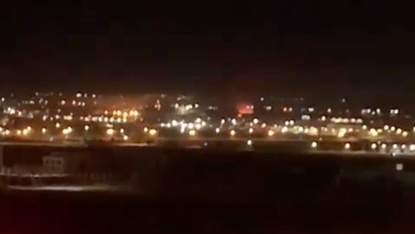Screenshot captures moment in which an explosion broke out along Iraq's Erbil International Airport on Wednesday, April 14. Reports later confirmed that the incident was part of a three-pronged strike against Turkish Armed Forces in Iraqi Kurdistan. - Sputnik International