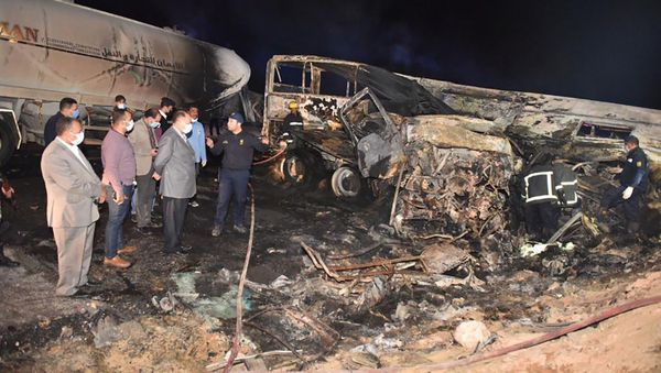 In this photo provided by Assiut Governorate media office, the authorities work on the collision site where a bus overturned Tuesday, while trying to pass a truck on a highway in southern Egypt on Wednesday, April 14, 2021, near the city of Assiut, Egypt. - Sputnik International
