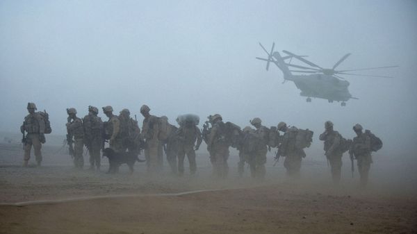 In this file photo US Marines from the 2nd Battalion, 8th Marine Regiment of the 2nd Marine Expeditionary Brigade wait for helicopter transport as part of Operation Khanjar at Camp Dwyer in Helmand Province in Afghanistan on July 2, 2009. - Sputnik International