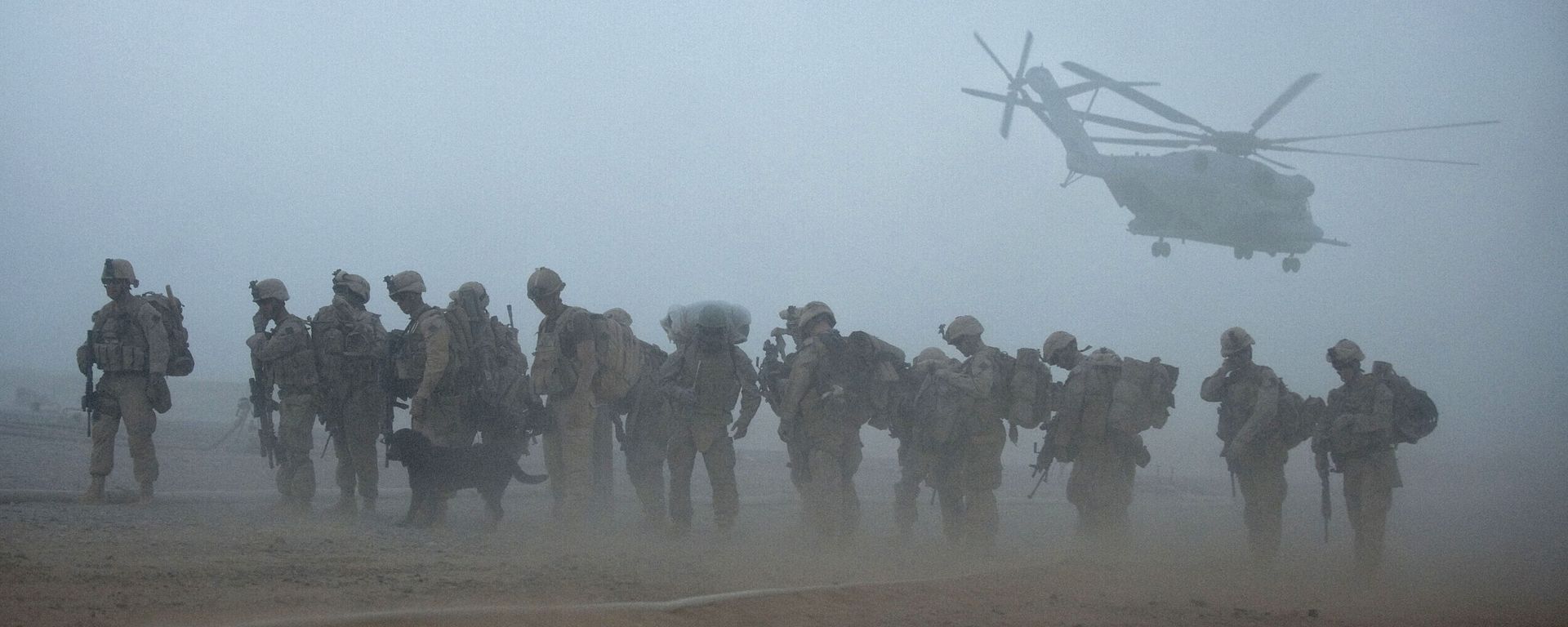In this file photo US Marines from the 2nd Battalion, 8th Marine Regiment of the 2nd Marine Expeditionary Brigade wait for helicopter transport as part of Operation Khanjar at Camp Dwyer in Helmand Province in Afghanistan on July 2, 2009. - Sputnik International, 1920, 28.07.2021