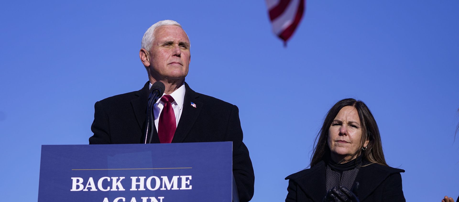 In this Jan. 20, 2021, file phot, former Vice President Mike Pence speaks after arriving back in his hometown of Columbus, Ind., as his wife Karen watches. - Sputnik International, 1920, 15.04.2021