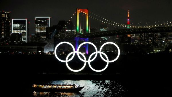 The Rainbow Bridge and Tokyo Tower are illuminated with Olympic colours to mark 100 days countdown to the Tokyo 2020 Olympics that have been postponed to 2021 due to the coronavirus disease (COVID-19) outbreak, in Tokyo, Japan April 14, 2021.  - Sputnik International