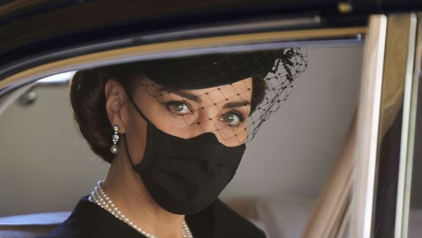 Duchess of Cambridge sits in a car during the funeral of Britain's Prince Philip, husband of Queen Elizabeth, who died at the age of 99, in Windsor, Britain, April 17, 2021. Chris Jackson/Pool via REUTERS    REFILE - QUALITY REPEAT - Sputnik International