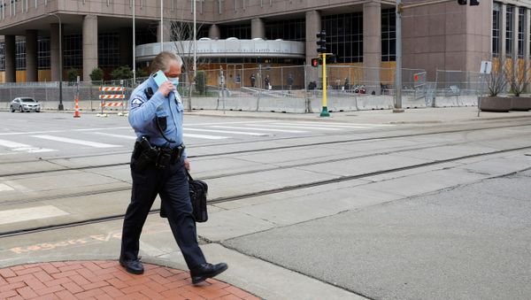 A Minneapolis police officer walks past the Hennepin County Public Safety Facility, during the trial of former police officer Derek Chauvin for the killing of George Floyd, and ongoing unrest following the killing of Daunte Wright by a police officer, in Minneapolis, Minnesota, U.S., April 14, 2021. A Minneapolis police officer walks past the Hennepin County Public Safety Facility, during the trial of former police officer Derek Chauvin for the killing of George Floyd, and ongoing unrest following the killing of Daunte Wright by a police officer, in Minneapolis, Minnesota, U.S., April 14, 2021. - Sputnik International