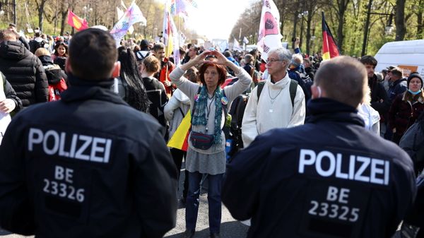 A demonstrator gestures in front of police officers during a protest against the government measures to curb the spread of the coronavirus disease (COVID-19), on the day of discussion in the lower house of parliament Bundestag regarding additions for the Infection Protection Act, in Berlin, Germany April 21, 2021 - Sputnik International