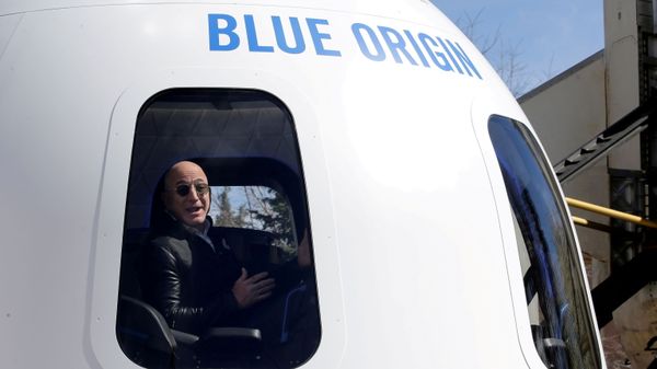 Amazon and Blue Origin founder Jeff Bezos addresses the media about the New Shepard rocket booster and Crew Capsule mockup at the 33rd Space Symposium in Colorado Springs, Colorado, United States April 5, 2017.  - Sputnik International