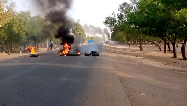 Tires burn at a fire barricade during protests demanding a return to civilian rule in N'Djamena, Chad 27 April 2021 in this still image obtained from social media video.  - Sputnik International
