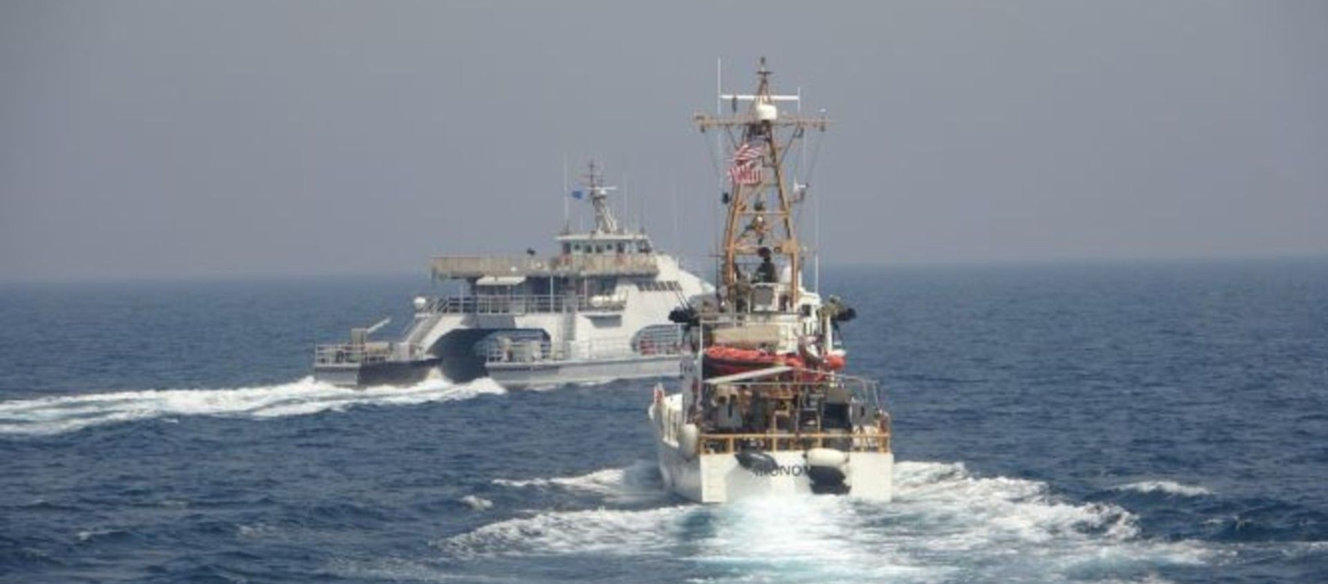 ARABIAN GULF (April 2, 2021) Iran’s Islamic Revolutionary Guard Corps Navy (IRGCN) Harth 55, left, conducted an unsafe and unprofessional action by crossing the bow of the Coast Guard patrol boat USCGC Monomoy (WPB 1326), right, as the U.S. vessel was conducting a routine maritime security patrol in international waters of the southern Arabian Gulf, Apr. 2. The USCGC ships are assigned to Patrol Forces Southwest Asia (PATFORSWA), the largest U.S. Coast Guard unit outside the United States, and operate under U.S. Naval Forces Central Command’s Task Force 55. ARABIAN GULF (April 2, 2021) Iran’s Islamic Revolutionary Guard Corps Navy (IRGCN) Harth 55, left, conducted an unsafe and unprofessional action by crossing the bow of the Coast Guard patrol boat USCGC Monomoy (WPB 1326), right, as the U.S. vessel was conducting a routine maritime security patrol in international waters of the southern Arabian Gulf, Apr. 2. The USCGC ships are assigned to Patrol Forces Southwest Asia (PATFORSWA), the largest U.S. Coast Guard unit outside the United States, and operate under U.S. Naval Forces Central Command’s Task Force 55. - Sputnik International, 1920, 27.04.2021
