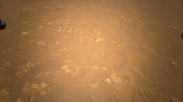 NASA's Mars helicopter Ingenuity captures an aerial photo of the Perseverance rover during its third test flight on April 25, 2021. - Sputnik International