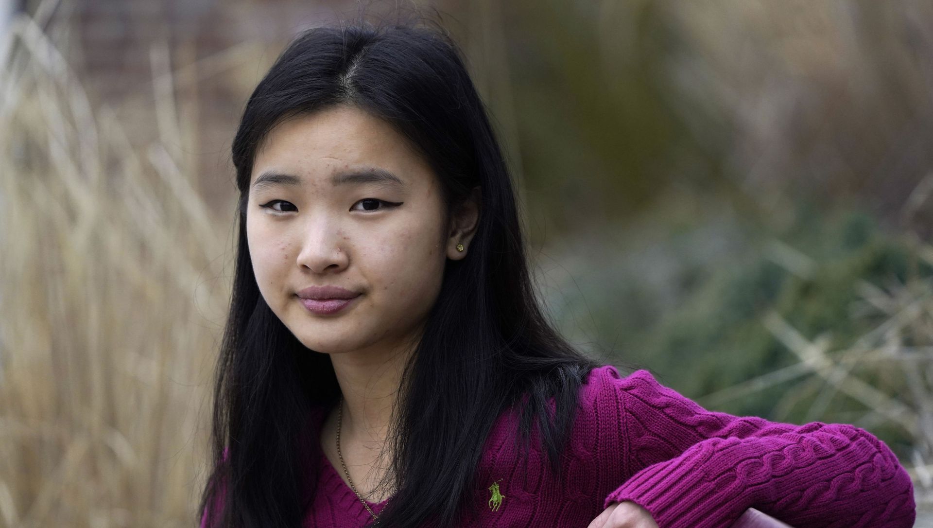 High school student Grace Hu, 16, of Sharon, Mass., stands for a photograph near Sharon High School, Sunday, April 11, 2021, in Sharon. Hu, who plans to to go back to in-person classes in April, helped organize a rally in Boston in early April against anti-Asian hate, but said she's not concerned about facing vitriol when her school reopens fully. High school student Grace Hu, 16, of Sharon, Mass., stands for a photograph near Sharon High School, Sunday, April 11, 2021, in Sharon. Hu, who plans to to go back to in-person classes in April, helped organize a rally in Boston in early April against anti-Asian hate, but said she's not concerned about facing vitriol when her school reopens fully. - Sputnik International, 1920, 29.04.2021