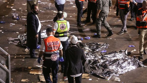 Medics and rescue workers attend to the Lag B'Omer event in Mount Meron, northern Israel, where fatalities were reported among the thousands of ultra-Orthodox Jews gathered at the tomb of a 2nd-century sage for annual commemorations that include all-night prayer and dance, at Mount Meron, Israel April 30, 2021 - Sputnik International