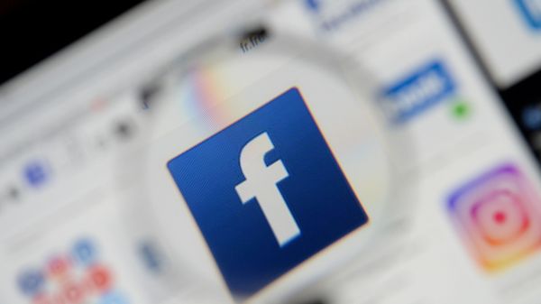 The Facebook logo is seen on a screen in this picture illustration taken December 2, 2019. - Sputnik International