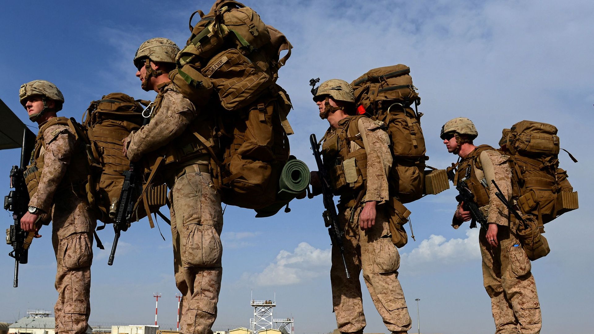 In this file photo taken on October 27, 2014, US Marines board a C-130J Super Hercules transport aircraft headed to Afghanistan's Kandahar as British and US forces withdraw from the Camp Bastion-Leatherneck complex at Lashkar Gah in Helmand province In this file photo taken on October 27, 2014, US Marines board a C-130J Super Hercules transport aircraft headed to Afghanistan's Kandahar as British and US forces withdraw from the Camp Bastion-Leatherneck complex at Lashkar Gah in Helmand province - Sputnik International, 1920, 07.06.2021
