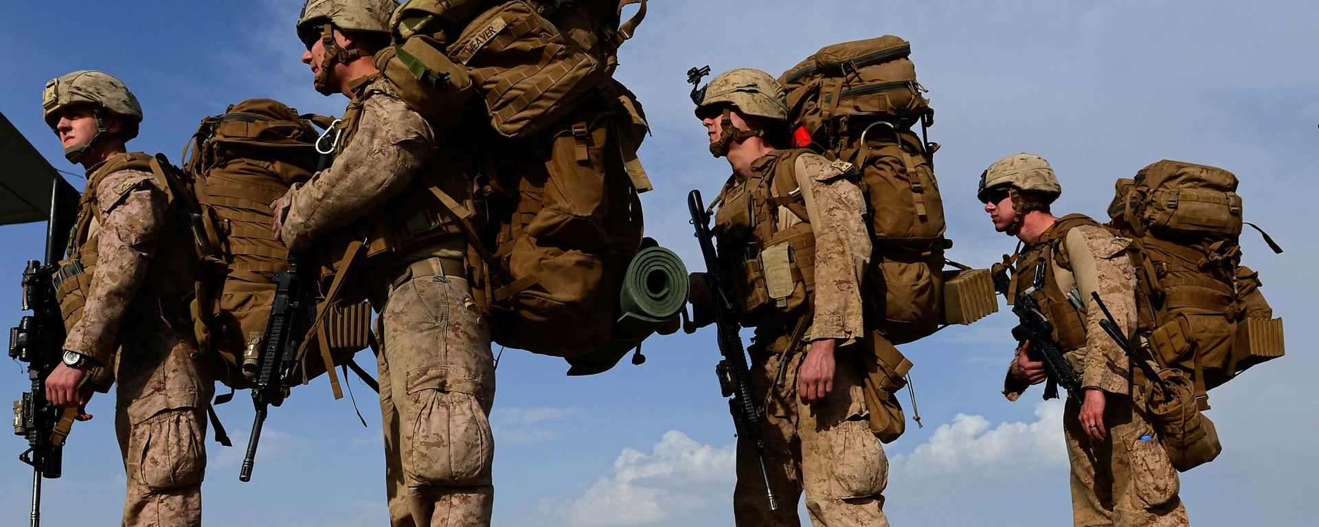 In this file photo taken on October 27, 2014, US Marines board a C-130J Super Hercules transport aircraft headed to Afghanistan's Kandahar as British and US forces withdraw from the Camp Bastion-Leatherneck complex at Lashkar Gah in Helmand province - Sputnik International, 1920, 07.06.2021