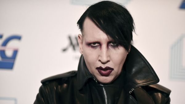 Marilyn Manson attends the 9th annual Home for the Holidays benefit concert in Los Angeles. Detectives are investigating Manson for allegations of domestic violence that reportedly occurred about a decade ago in West Hollywood, authorities said. The domestic violence is believed to have occurred between 2009 and 2011, when Manson lived in the city of West Hollywood. - Sputnik International