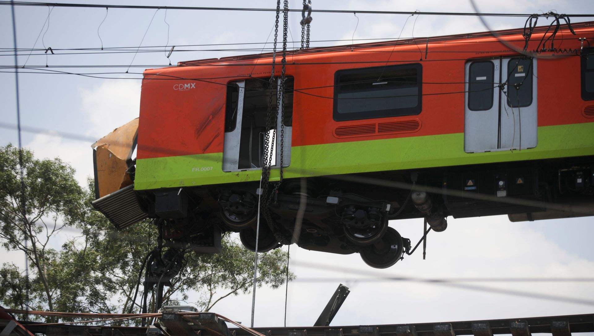Workers move a train car from a site where an overpass for a metro partially collapsed with train cars on it at Olivos station in Mexico City, Mexico May 4, 2021 Workers move a train car from a site where an overpass for a metro partially collapsed with train cars on it at Olivos station in Mexico City, Mexico May 4, 2021 - Sputnik International, 1920, 04.05.2021