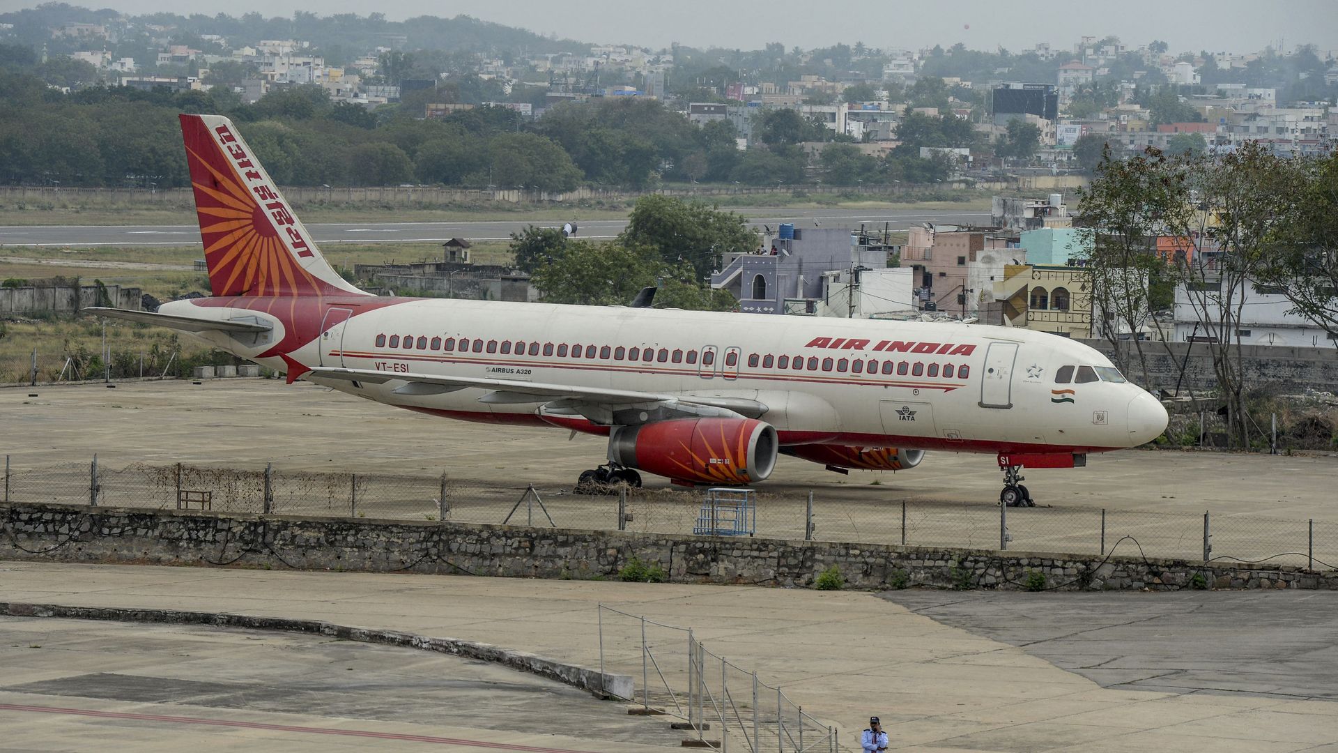 A security personnel stands guard near an Air India Airbus A-320 displayed at Begumpet Airport in Hyderabad on March 14, 2020. A security personnel stands guard near an Air India Airbus A-320 displayed at Begumpet Airport in Hyderabad on March 14, 2020. - Sputnik International, 1920, 05.05.2021