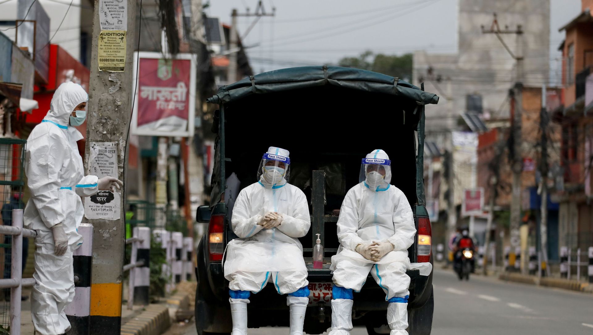 Members of Nepal army personnel wearing personal protective equipment (PPE) rest on a vehicle as they wait to transport a body of a person who died from coronavirus disease (COVID-19) to the crematorium, while Nepal is overwhelmed by a COVID-19 surge as India's outbreak spreads across South Asia, in Kathmandu, Nepal May 5, 2021. Members of Nepal army personnel wearing personal protective equipment (PPE) rest on a vehicle as they wait to transport a body of a person who died from coronavirus disease (COVID-19) to the crematorium, while Nepal is overwhelmed by a COVID-19 surge as India's outbreak spreads across South Asia, in Kathmandu, Nepal May 5, 2021. - Sputnik International, 1920, 11.05.2021