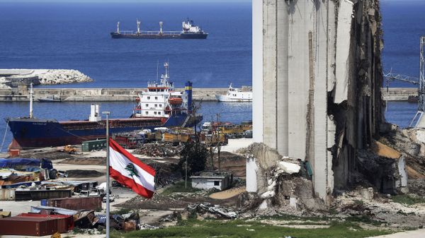 A picture shows a view of the damaged grain silos at the port of the Lebanese capital Beirut, on April 9, 2021, still reeling from the destruction due to a catastrophic blast in a harbour storage unit last August that killed more than 200 people and damaged swathes of the capital, with the Togo-flagged Fatima M bulk carrier ship moored nearby.  - Sputnik International