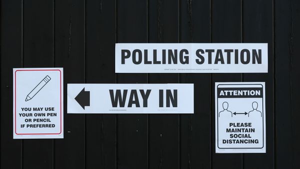 Signs pointing the way to a polling station and advising voters to maintain social distancing are seen at Fulwell Mill ahead of local elections, amid the coronavirus disease (COVID-19) pandemic, in Sunderland, Britain May 6, 2021.  - Sputnik International