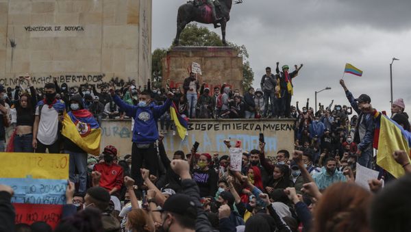 Anti-government demonstrators protest in Bogota, Colombia, Wednesday, May 5, 2021. The protests that began last week over a tax reform proposal continue despite President Ivan Duque's withdrawal of the tax plan on Sunday, May 2. - Sputnik International