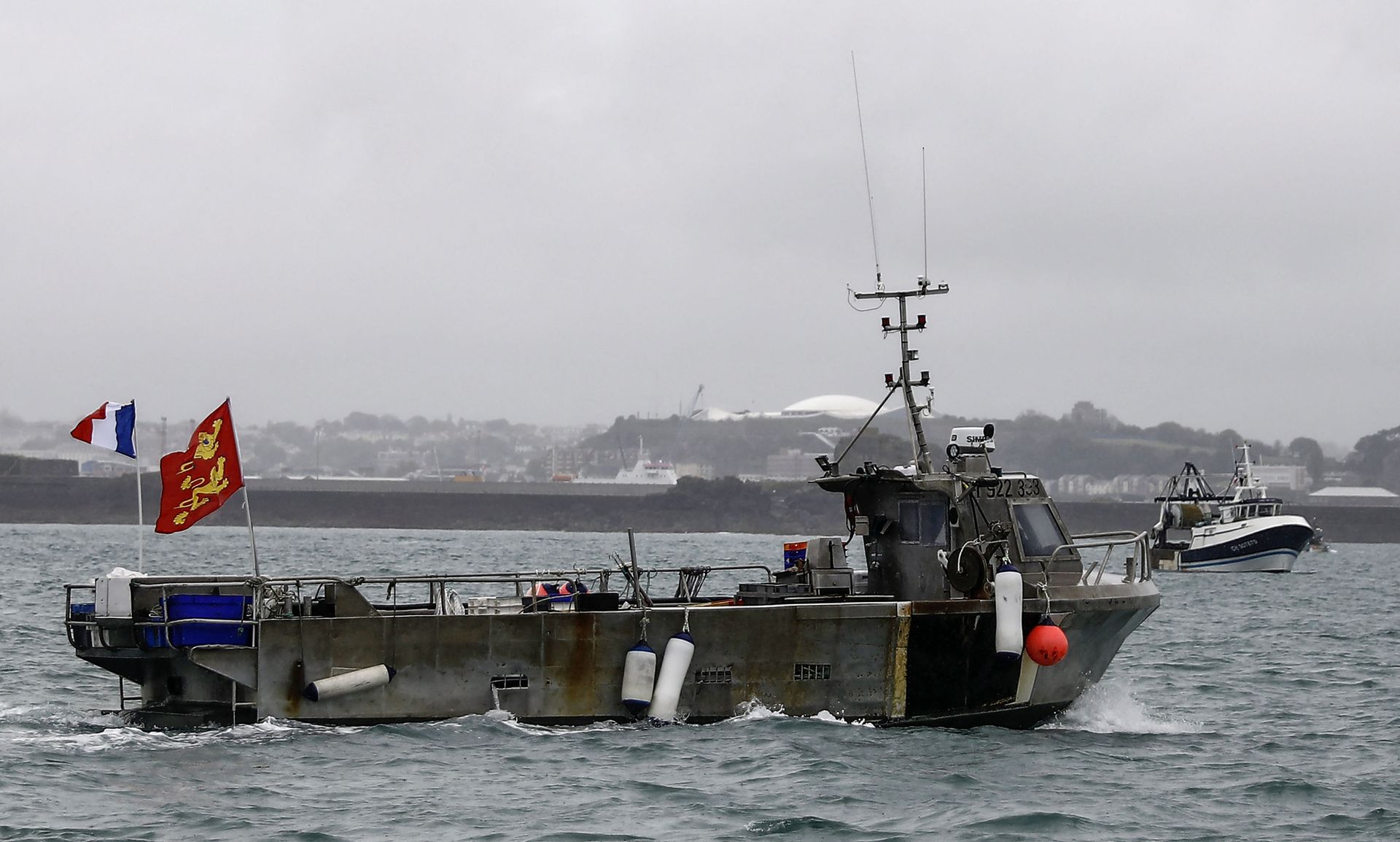 A French fishing boat, one of several, takes part in a protest in front of the port of Saint Helier off the British island of Jersey to draw attention to what they see as unfair restrictions on their ability to fish in UK waters after Brexit, on May 6, 2021. - - Sputnik International, 1920, 01.11.2021
