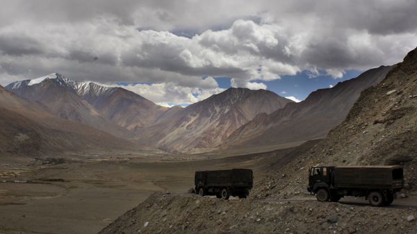 FILE- In this Sept. 14, 2017, file photo, Indian army trucks drive near Pangong Tso lake near the India China border in India's Ladakh area. The Indian army said Saturday, Jan. 9, 2020, that it has apprehended a Chinese soldier in the remote Ladakh region, where the two countries are locked in a monthslong military standoff along their disputed mountain border. An army statement said the Chinese soldier was taken into custody on Friday for transgressing into the Indian side in area South of Pangong Tso lake. (AP Photo/Manish Swarup) - Sputnik International