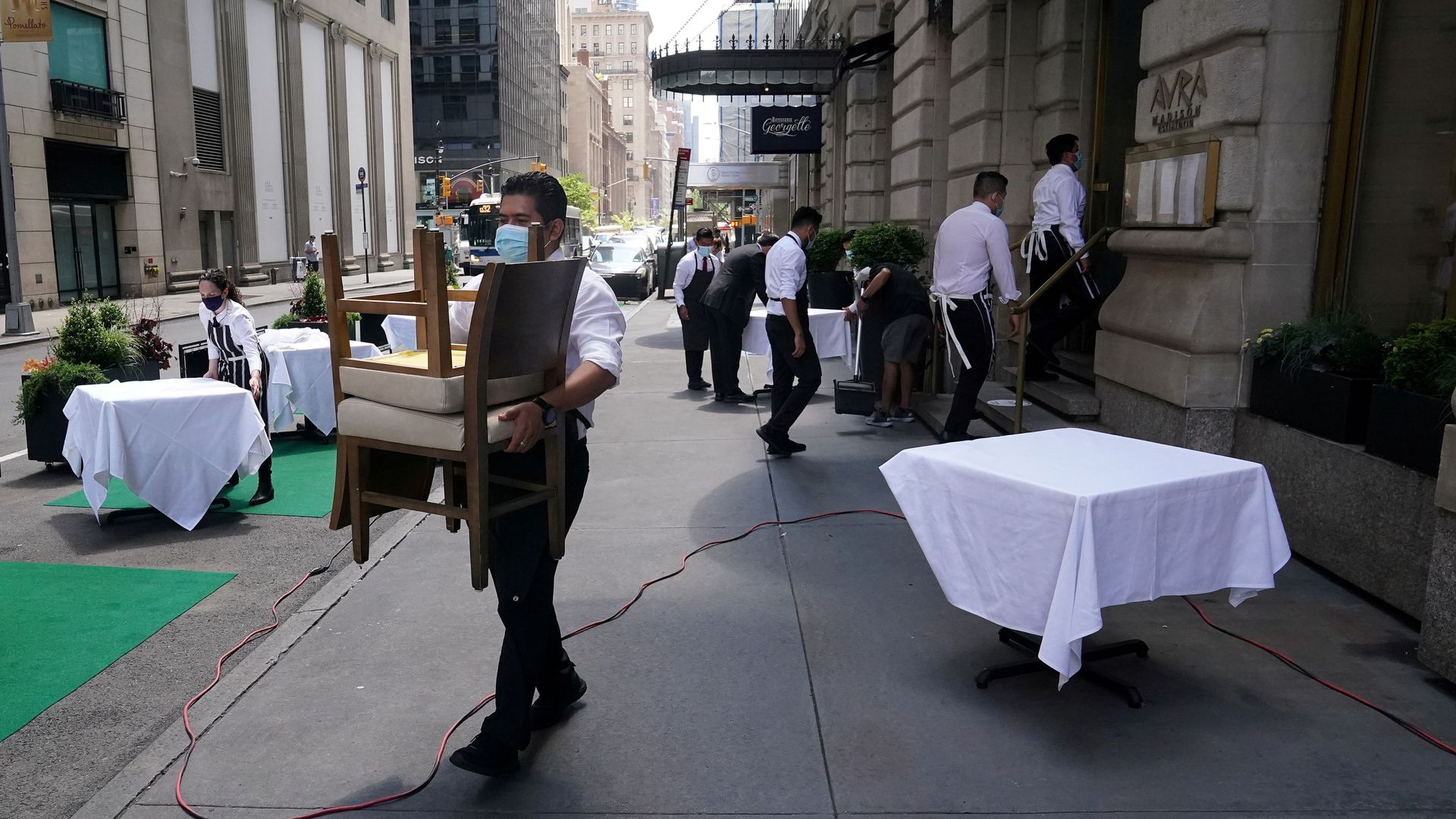 FILE PHOTO: A waiter sets up tables in front of a restaurant on a street on the first day of the phase two re-opening of businesses following the outbreak of the coronavirus disease (COVID-19), in the Manhattan borough of New York City, New York, U.S., June 22, 2020. FILE PHOTO: A waiter sets up tables in front of a restaurant on a street on the first day of the phase two re-opening of businesses following the outbreak of the coronavirus disease (COVID-19), in the Manhattan borough of New York City, New York, U.S., June 22, 2020. - Sputnik International, 1920, 08.05.2021
