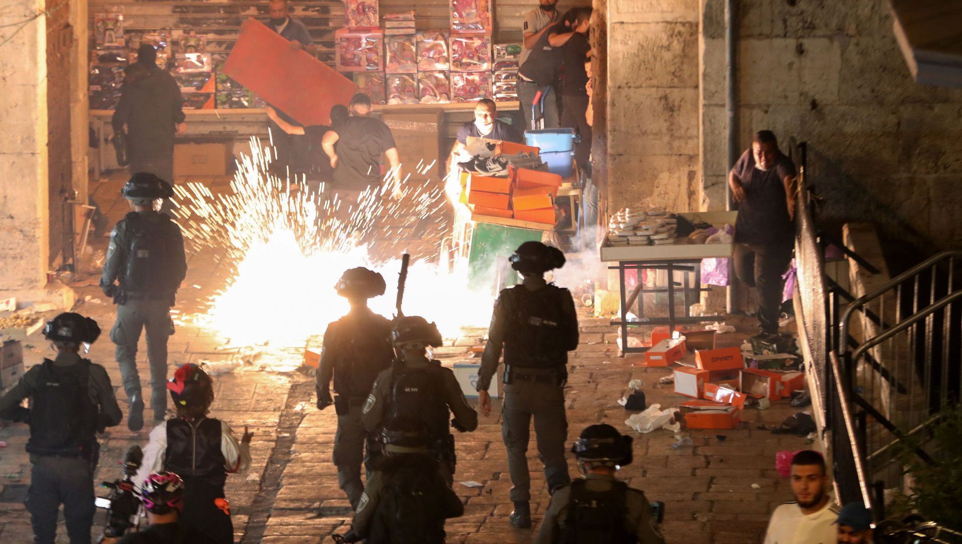 Palestinians react as Israeli police fire a stun grenade during clashes at Damascus Gate on Laylat al-Qadr during the holy month of Ramadan, in Jerusalem's Old City, May 9, 2021 Palestinians react as Israeli police fire a stun grenade during clashes at Damascus Gate on Laylat al-Qadr during the holy month of Ramadan, in Jerusalem's Old City, May 9, 2021 - Sputnik International, 1920, 08.05.2021