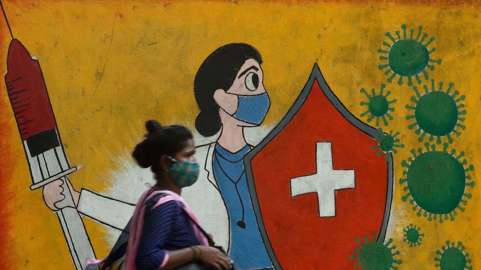 A woman walks past graffiti on a street, as the coronavirus disease (COVID-19) spreads in Mumbai, India, 10 May 2021. A woman walks past graffiti on a street, as the coronavirus disease (COVID-19) spreads in Mumbai, India, 10 May 2021. - Sputnik International, 1920, 14.05.2021