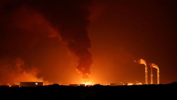 A large fire is seen near the scene of what officials said was a Gaza rocket attack on an Israeli energy pipeline near Ashkelon, Israel, May 11, 2021. - Sputnik International