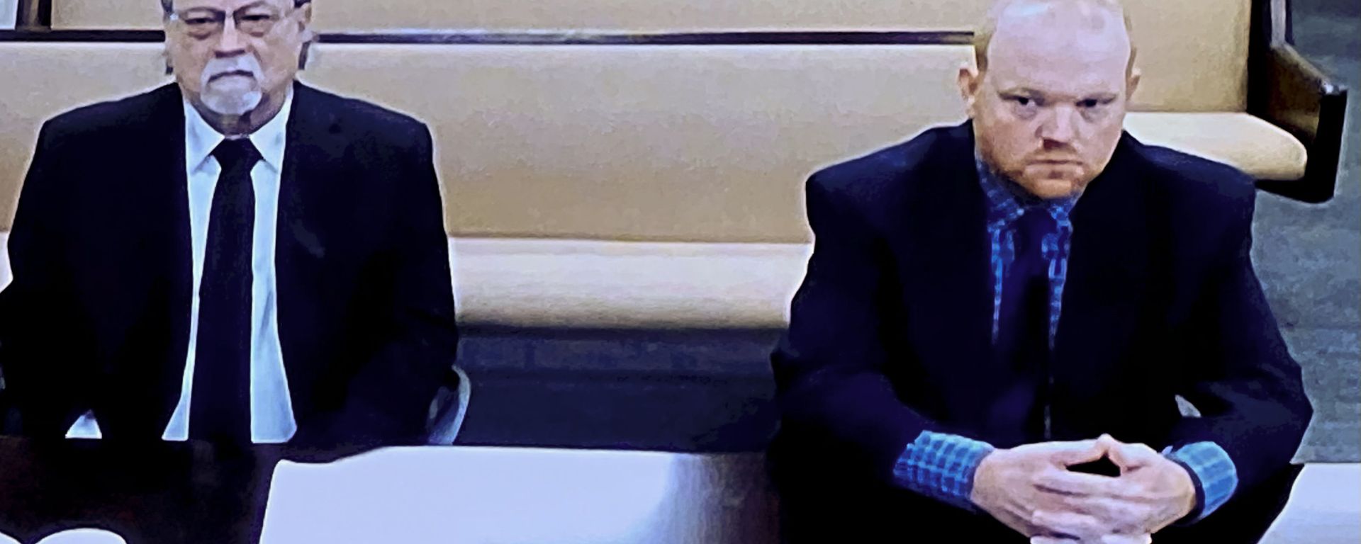 In this image made from video, from left, father and son, Gregory and Travis McMichael, accused in the shooting death of Ahmaud Arbery in Georgia on Feb. 2020, listen via closed circuit tv in the Glynn County Detention center in Brunswick, Ga., on Thursday, Nov. 12, as lawyers argue for bond to be set at the Glynn County courthouse. In this image made from video, from left, father and son, Gregory and Travis McMichael, accused in the shooting death of Ahmaud Arbery in Georgia on Feb. 2020, listen via closed circuit tv in the Glynn County Detention center in Brunswick, Ga., on Thursday, Nov. 12, as lawyers argue for bond to be set at the Glynn County courthouse. - Sputnik International, 1920, 12.05.2021