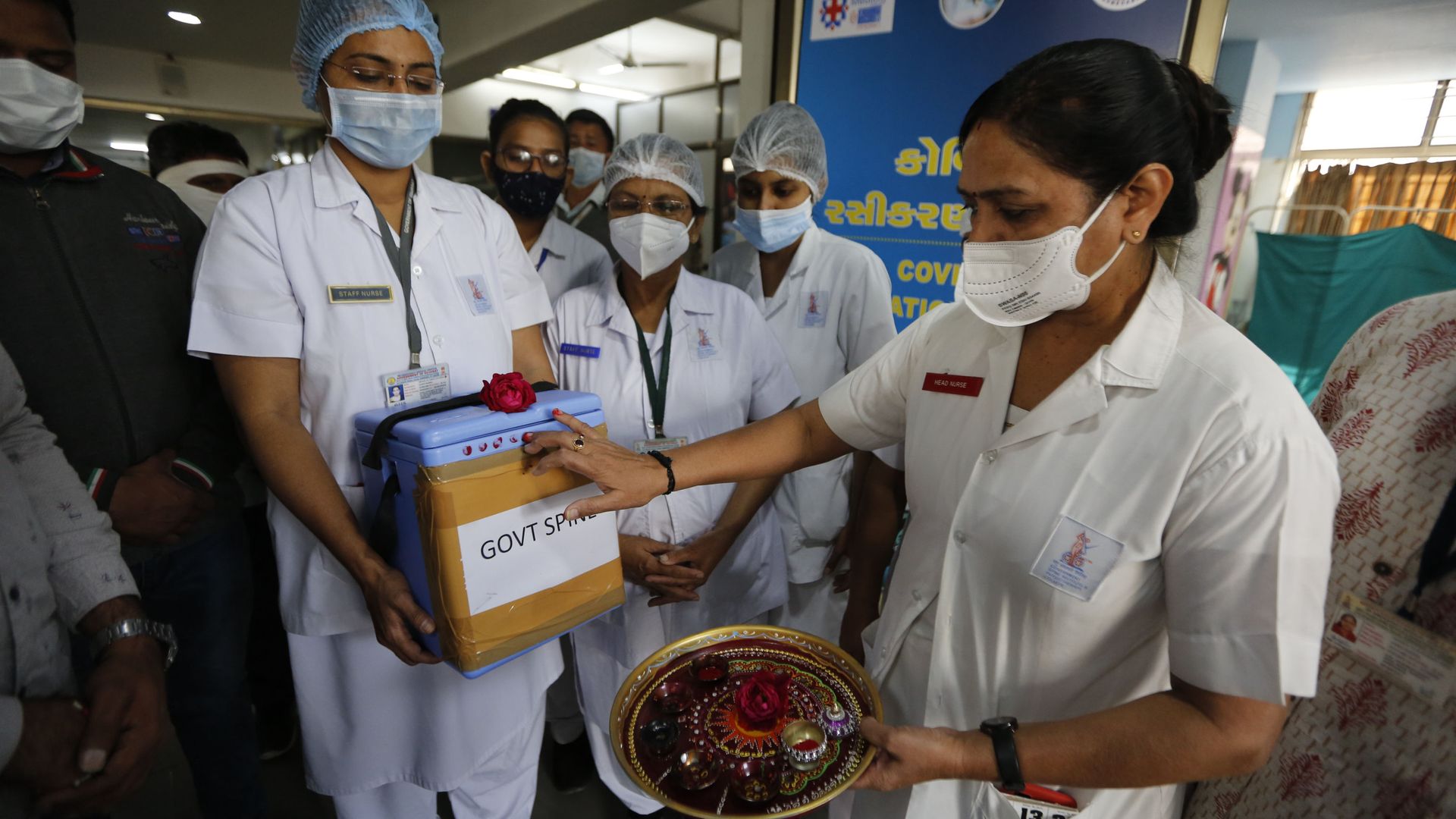 A nurse, right, takes delivery of a box containing COVID-19 vaccines as it arrives at a government hospital in Ahmedabad, Gujarat state, India on Saturday, 16 January 2021. A nurse, right, takes delivery of a box containing COVID-19 vaccines as it arrives at a government hospital in Ahmedabad, Gujarat state, India on Saturday, 16 January 2021. - Sputnik International, 1920, 12.05.2021