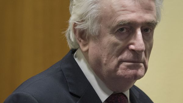 Former Bosnian Serb leader Radovan Karadzic enters the court room of the International Residual Mechanism for Criminal Tribunals in The Hague, Netherlands, Wednesday, March 20, 2019 - Sputnik International