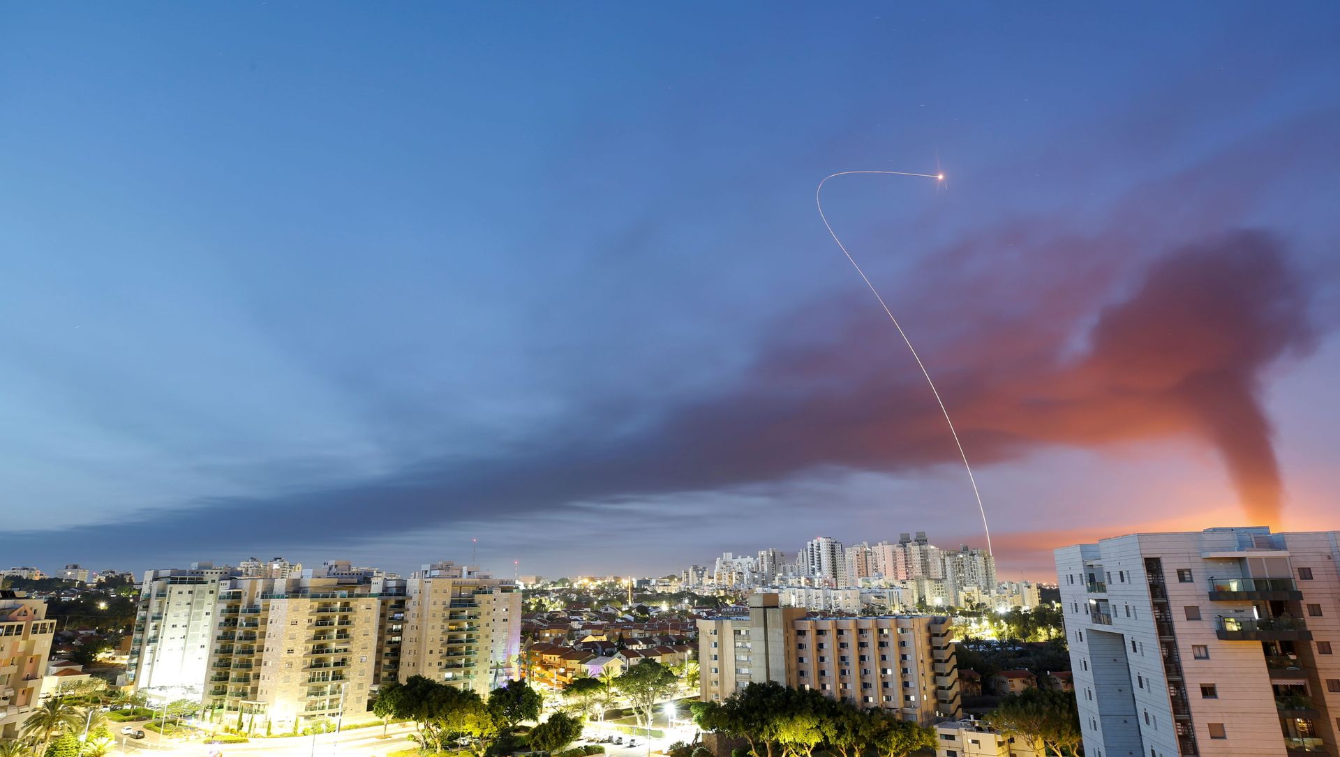 A streak of light is seen as Israel's Iron Dome anti-missile system intercepts rockets launched from the Gaza Strip towards Israel, as seen from Ashkelon, Israel May 12, 2021. A streak of light is seen as Israel's Iron Dome anti-missile system intercepts rockets launched from the Gaza Strip towards Israel, as seen from Ashkelon, Israel May 12, 2021. - Sputnik International, 1920, 13.05.2021