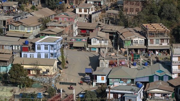 Residential houses on the Myanmar's side are seen at Zokhawthar in the India's northeastern state of Mizoram on March 15, 2021 Residential houses on the Myanmar's side are seen at Zokhawthar in the India's northeastern state of Mizoram on March 15, 2021 - Sputnik International