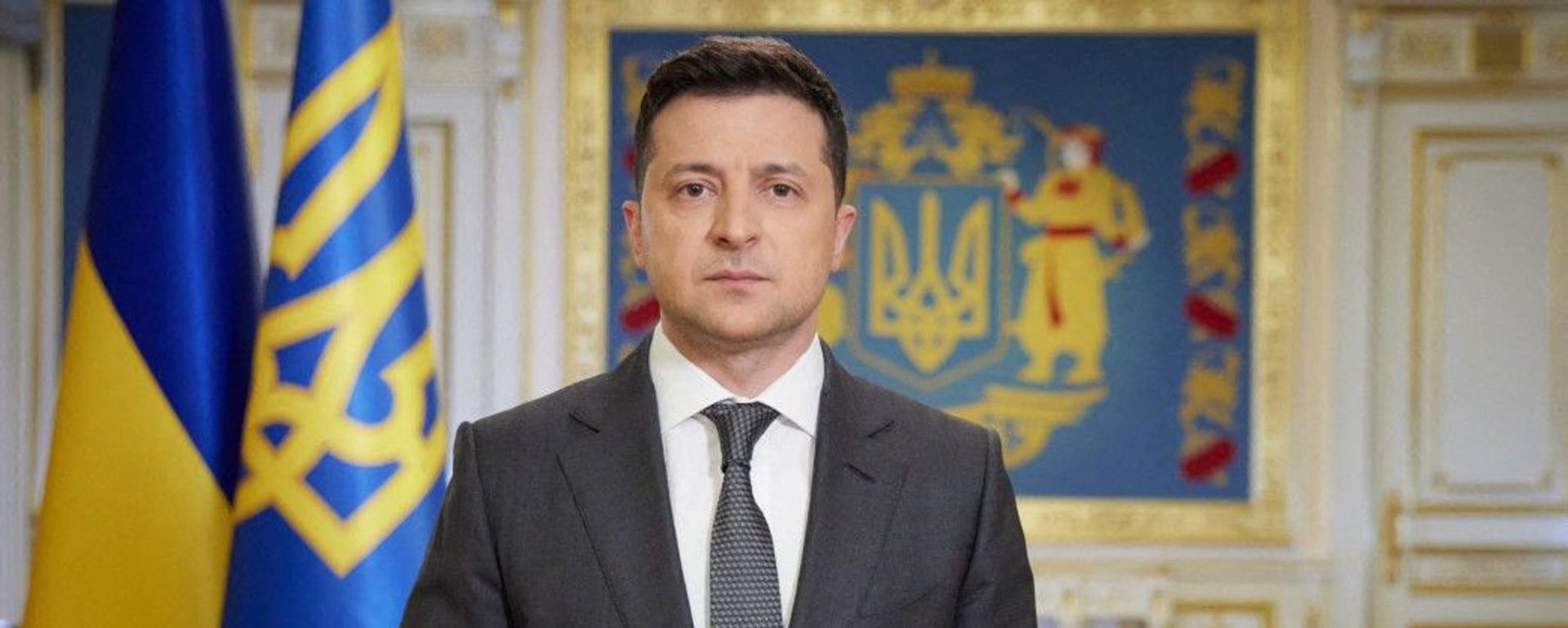 This handout photograph taken and released by The Ukrainian Presidential Press Service on April 20, 2021, shows Ukranian President Volodymyr Zelensky speaking during his late evening address in Kiev.  - Sputnik International, 1920, 08.03.2022