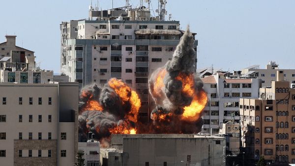 A ball of fire erupts from the Jala Tower as it is destroyed in an Israeli airstrike in Gaza city controlled by the Palestinian Hamas movement, on 15 May 2021. - Sputnik International