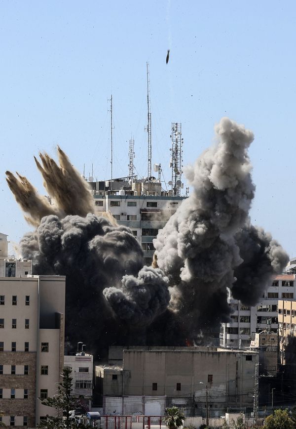 Smoke billows from a building housing various international media, including The Associated Press, after the Israeli airstrike. Smoke billows from a building housing various international media, including The Associated Press, after the Israeli airstrike. - Sputnik International