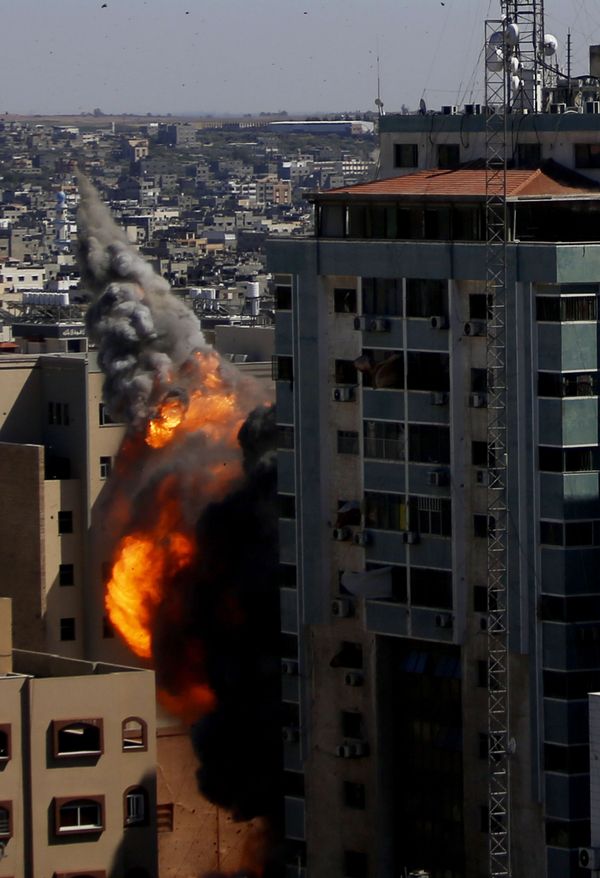 A view of the 13-story building moments after it was hit. A view of the 13-story building moments after it was hit. - Sputnik International