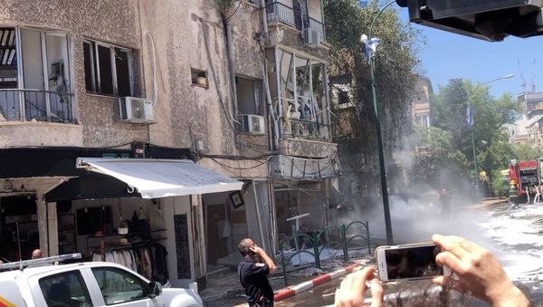 View of a building damaged by a rocket fired from Gaza, in Ramat Gan, Tel Aviv District, Israel May 15, 2021 in this still image obtained from social media video. - Sputnik International
