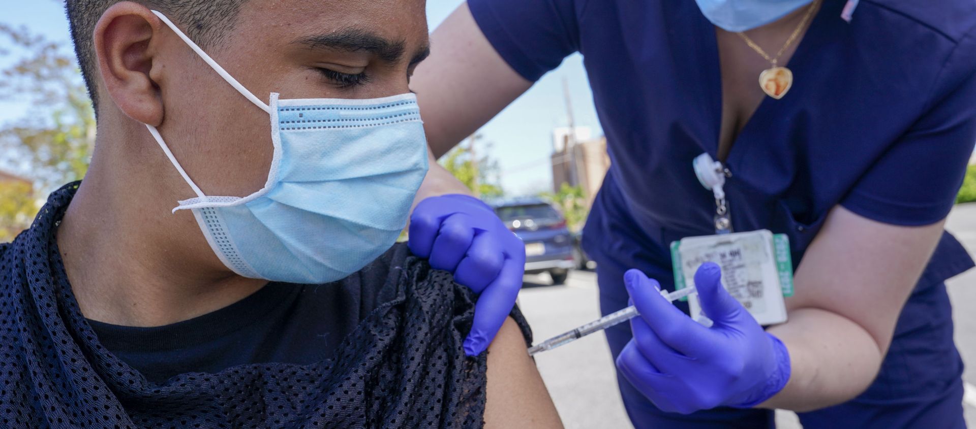 Justin Bishop, 13, watches as Registered Nurse Jennifer Reyes inoculates him with the first dose of the Pfizer COVID-19 vaccine at the Mount Sinai South Nassau Vaxmobile parked at the De La Salle School, Friday, May 14, 2021, in Freeport, N.Y. Justin Bishop, 13, watches as Registered Nurse Jennifer Reyes inoculates him with the first dose of the Pfizer COVID-19 vaccine at the Mount Sinai South Nassau Vaxmobile parked at the De La Salle School, Friday, May 14, 2021, in Freeport, N.Y. - Sputnik International, 1920, 16.05.2021