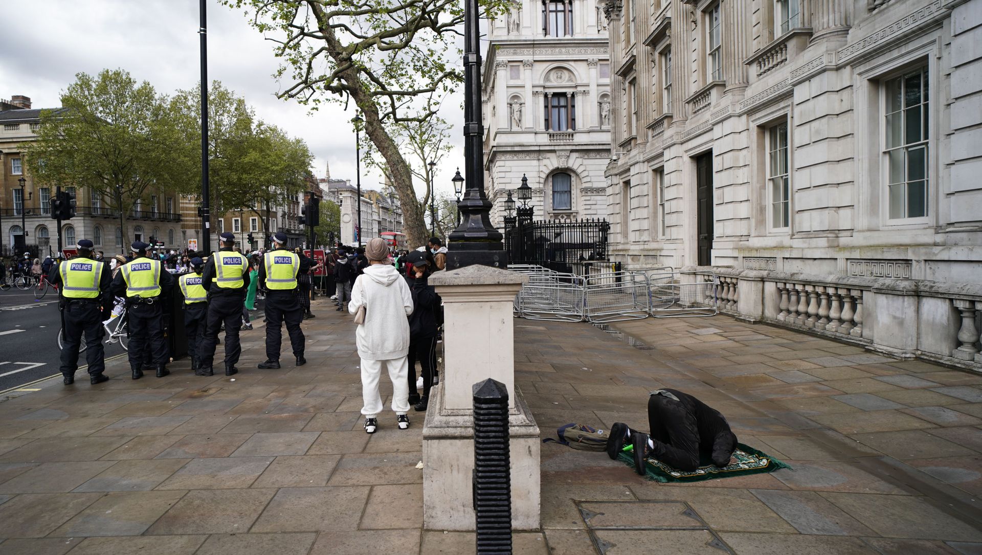 A man prays as people gather outside Downing Street to protest against Israeli attacks on Palestinians in Gaza, in London, Saturday, May 15, 2021 A man prays as people gather outside Downing Street to protest against Israeli attacks on Palestinians in Gaza, in London, Saturday, May 15, 2021 - Sputnik International, 1920, 16.05.2021