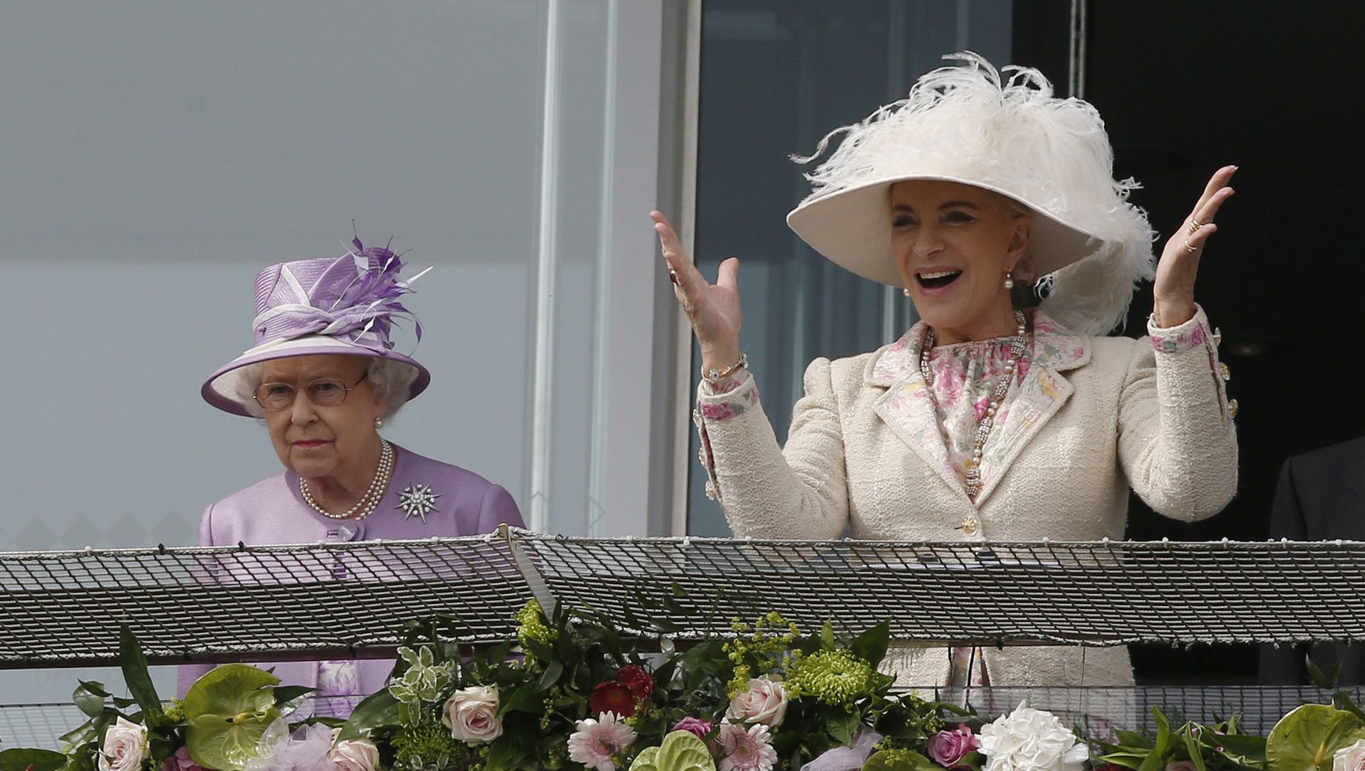Britain's Queen Elizabeth II, left, looks on from the balcony as Princess Michael of Kent reacts to the winning horse at the end of Epsom Derby at Epsom racecourse, England, Saturday, 7 June 2014. Britain's Queen Elizabeth II, left, looks on from the balcony as Princess Michael of Kent reacts to the winning horse at the end of Epsom Derby at Epsom racecourse, England, Saturday, 7 June 2014. - Sputnik International, 1920, 16.05.2021