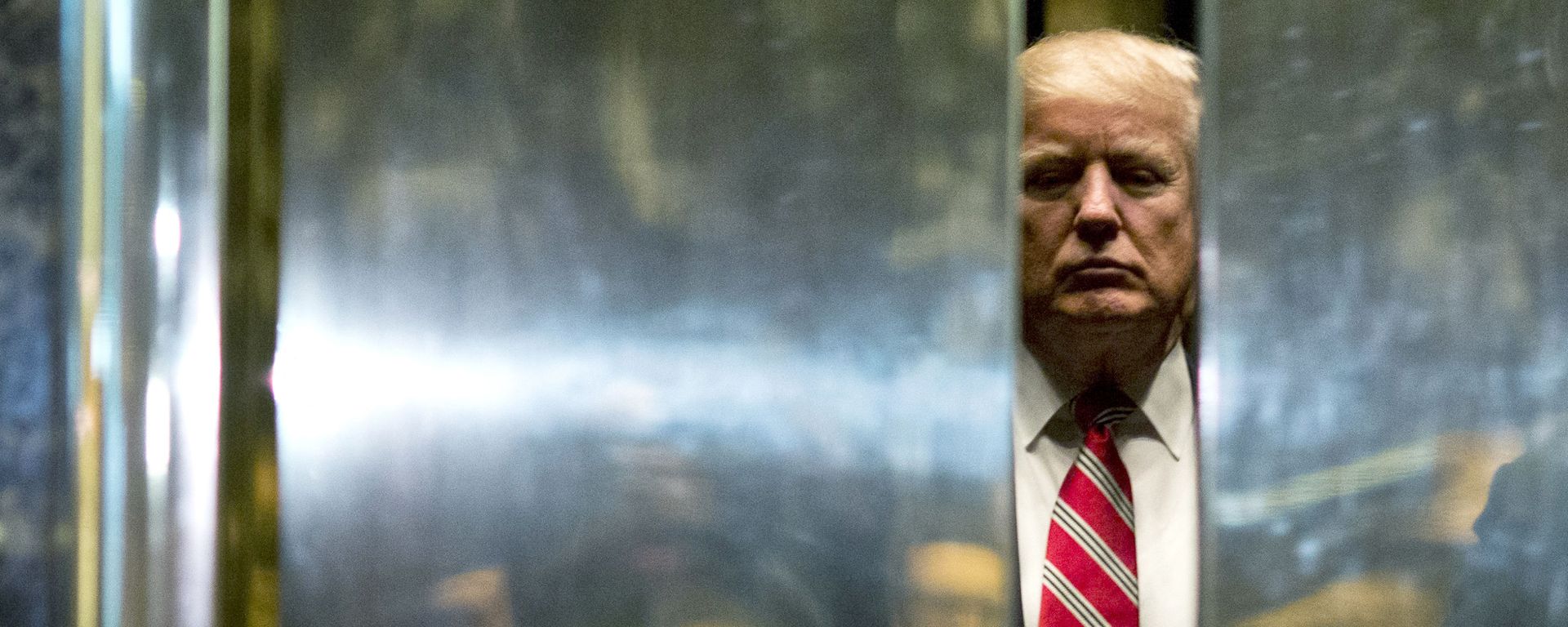 In this file photo taken on January 16, 2017 US President-elect Donald Trump boards the elevator after escorting Martin Luther King III to the lobby after meetings at Trump Tower in New York City. - The Trump Organization is being investigated in a criminal capacity as New York prosecutors advance their probe into former president Donald Trump's business dealings, the state attorney general announced Tuesday. We have informed the Trump Organization that our investigation into the organization is no longer purely civil in nature, a spokesman for Attorney General Letitia James' office said. We are now actively investigating the Trump Organization in a criminal capacity, along with the Manhattan DA. - Sputnik International, 1920, 24.10.2022