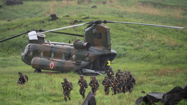 French soldiers walk from a Chinook helicopter during a joint military drill between Japan Self-Defense Forces, French Army and U.S. Marines, at the Kirishima exercise area in Ebino, Miyazaki prefecture, Japan May 15, 2021 - Sputnik International