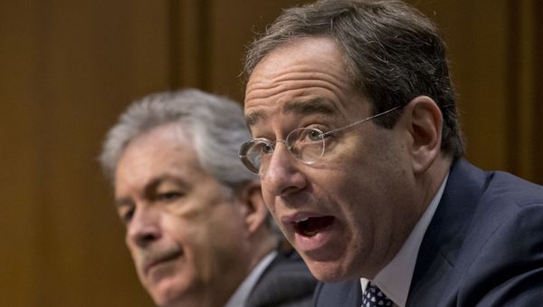 The Senate Foreign Relations Committee holds a hearing with Deputy Secretary of State Thomas Nides, right, who is in charge of management, and Deputy Secretary of State William Burns,left, who is in charge of policy, after an independent review panel said this week that serious bureaucratic mismanagement was responsible for inadequate security at the mission in Benghazi, Libya, where the U.S. ambassador and three other Americans were killed on Sept. 11, on Capitol Hill in Washington, Thursday, Dec. 20, 2012. Secretary of State Hillary Rodham Clinton had been scheduled to testify but canceled after fainting and sustaining a concussion last week. (AP Photo/J. Scott Applewhite) - Sputnik International