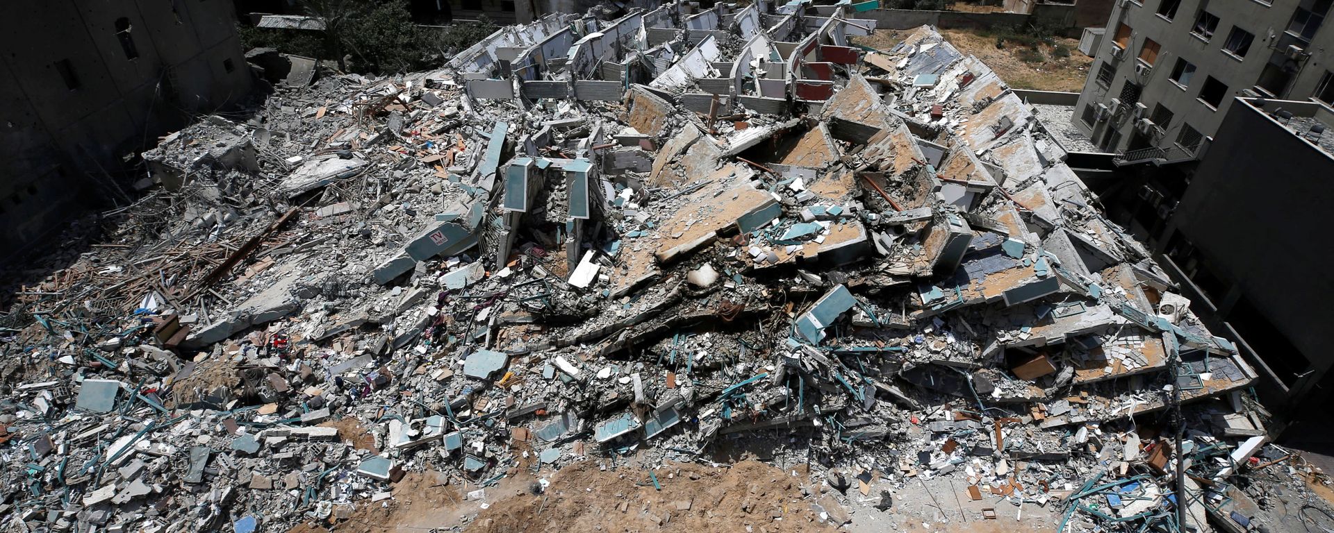 A view shows the remains of a tower building destroyed by Israeli missile strikes in the recent cross-border violence between Palestinian militants and Israel, following Israel-Hamas truce, in Gaza City May 21, 2021 A view shows the remains of a tower building destroyed by Israeli missile strikes in the recent cross-border violence between Palestinian militants and Israel, following Israel-Hamas truce, in Gaza City May 21, 2021 - Sputnik International, 1920, 02.02.2022