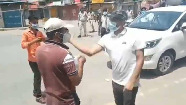 Shocking visuals from Surajpur in Chhattisgarh collector snatched phone, slapped a boy gone out to buy medicines, polices also caned him, FIR lodged against the boy - Sputnik International